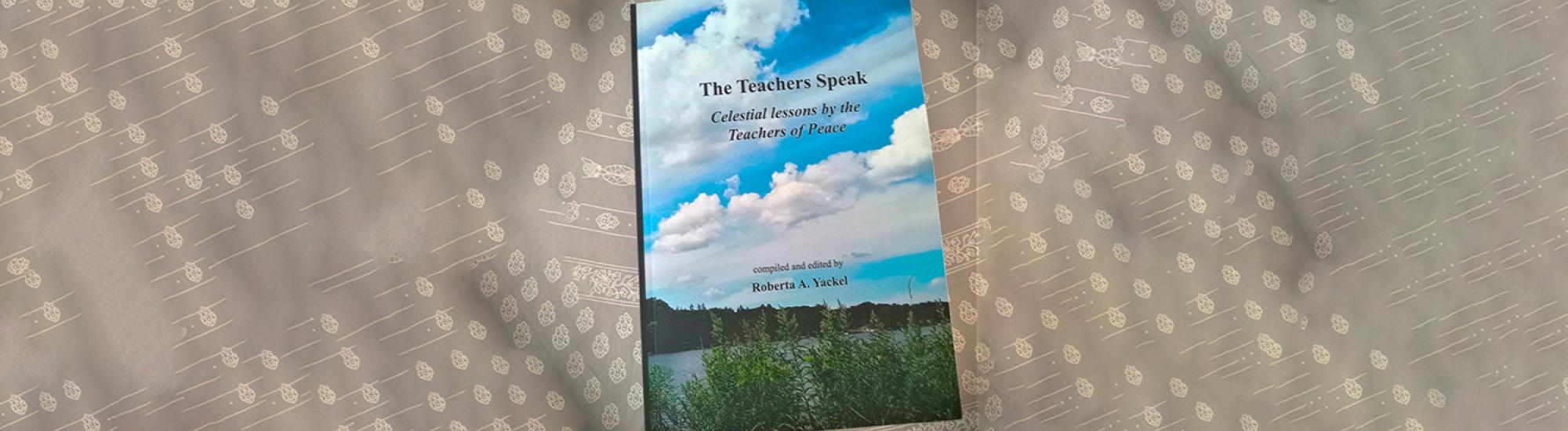 gray backdrop with a book, cover photo of blue sky and clouds and green grassy field, title 'the teachers of peace'